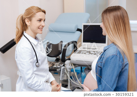 Joyful medical specialist consulting pregnant Joyful medical specialist consulting pregnant 30159321