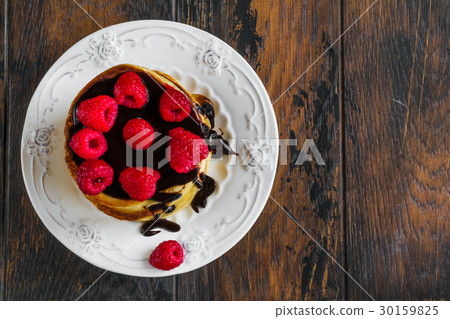 Stack of homemade pancakes with raspberries 30159825