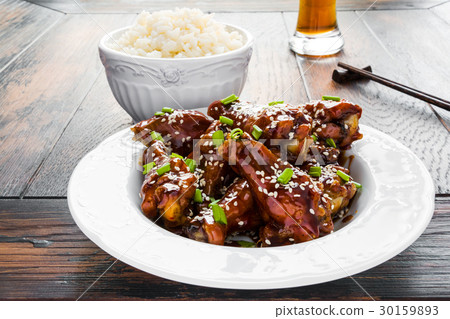 Crispy sesame chicken wings with a sticky sauce Crispy sesame chicken wings with a sticky sauce 30159893