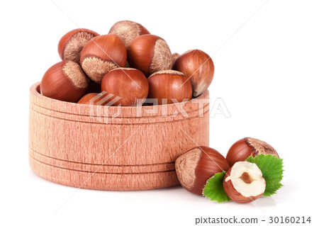 Hazelnuts with leaves in a wooden bowl isolated on 30160214