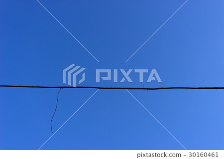 The black wire on a background of blue sky The black wire on a background of blue sky 30160461