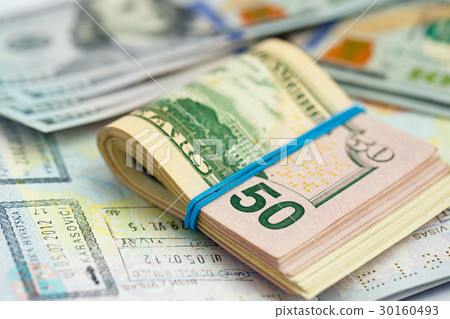 American money is on the top of the passport American money is on the top of the passport 30160493