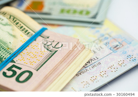 American money is on the top of the passport American money is on the top of the passport 30160494