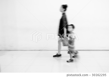 Motion blur mother and son 30162295