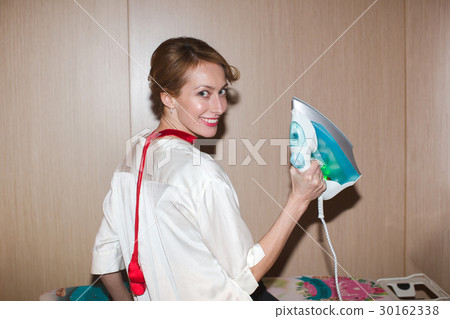 Woman ironing clothes 30162338