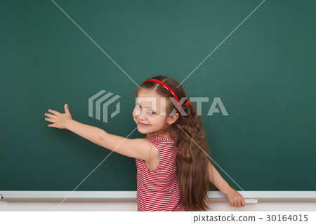 girl drawing on school board, education concept 30164015