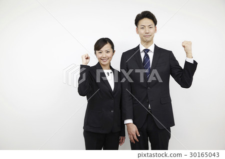 Young men and women in business suit, white back, guts pose Young men and women in business suit, white back, guts pose 30165043