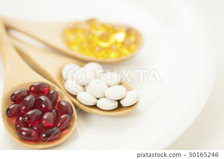 Spoon and supplement tablets health food health maintenance dietary supplement 30165246