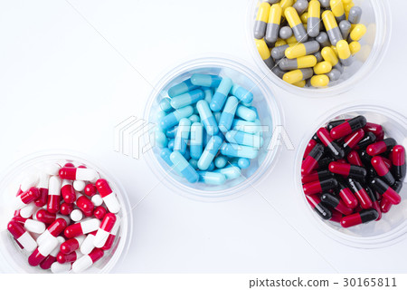 pile of medical pills and pills on background. pile of medical pills and pills on background. 30165811