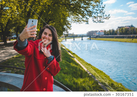woman talking on the phone while walking 30167351