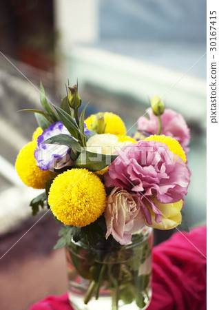 Bunch of flowers in a glass jar Bunch of flowers in a glass jar 30167415