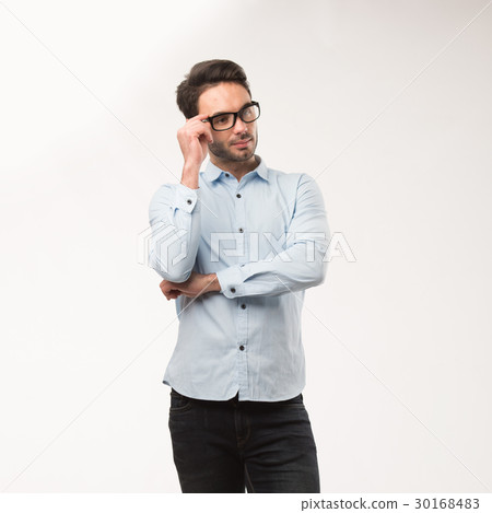 Young happy man showing presentation, pointing on Young happy man showing presentation, pointing on 30168483