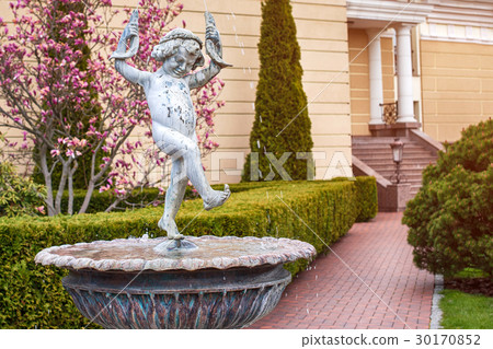 Fountain in the park with statue of dancing boy 30170852