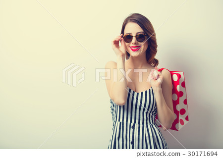 young woman with shopping bag  30171694