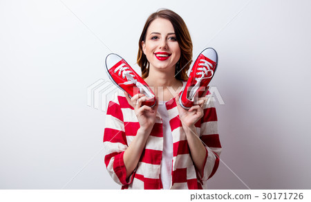 portrait of beautiful young woman with gumshoes portrait of beautiful young woman with gumshoes 30171726