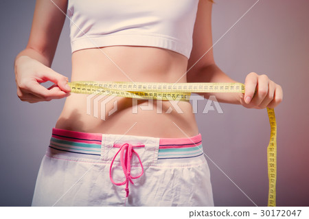 photo of perfect female body with centimeter 30172047