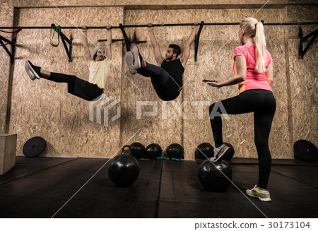 Sport Fitness People Group Doing Pull Ups At 30173104