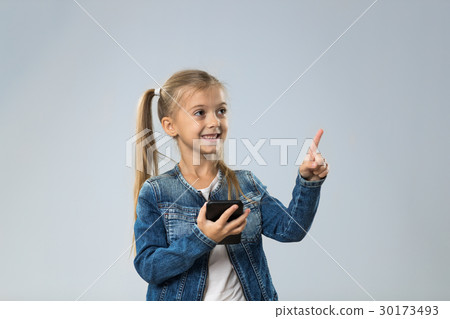 Little Teenage Girl Using Cell Smart Phone, Small Little Teenage Girl Using Cell Smart Phone, Small 30173493