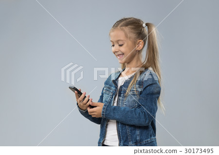 Little Teenage Girl Using Cell Smart Phone, Small Little Teenage Girl Using Cell Smart Phone, Small 30173495