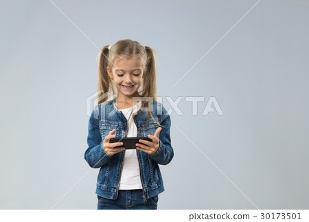 Little Teenage Girl Using Cell Smart Phone, Small Little Teenage Girl Using Cell Smart Phone, Small 30173501