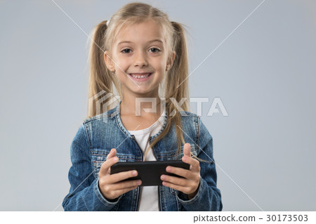 Little Teenage Girl Using Cell Smart Phone, Small Little Teenage Girl Using Cell Smart Phone, Small 30173503