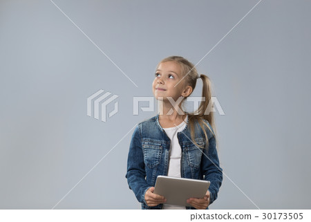 Little Teenage Girl Using Tablet Computer, Small 30173505