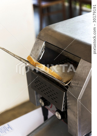 Sliced bread in Toaster for breakfast 30179191