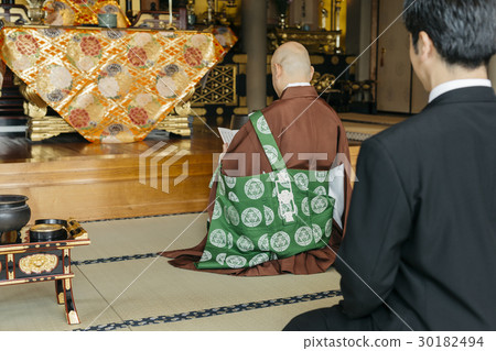 a visit to a grave  30182494