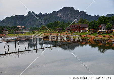 People who cross the scenic spot of Laos, Bambien beautiful mountain and Song River bamboo bridge 30182733