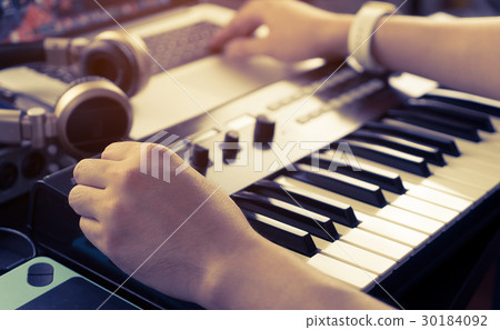 Music producer is working on home studio set up Music producer is working on home studio set up 30184092