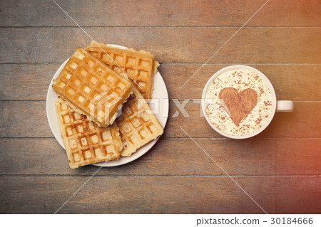 photo of plate full of waffles and cup of coffee 30184666