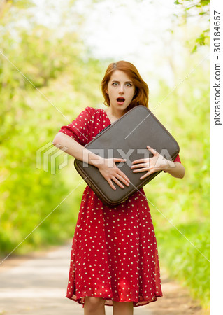 photo of beautiful young woman with suitcase photo of beautiful young woman with suitcase 30184667
