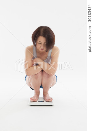 A woman on a scale A woman on a scale 30185484