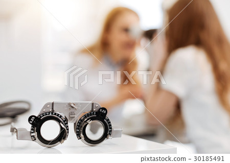 Professional prominent ophthalmologist doing her 30185491