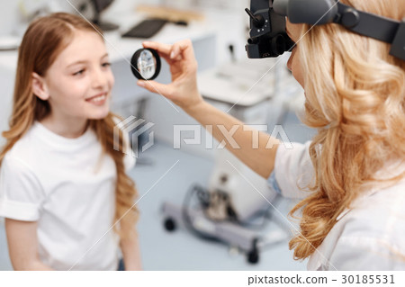 Diligent neat girl trying not to blink Diligent neat girl trying not to blink 30185531