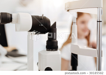 Distinguished optician having a lot of equipment 30185582