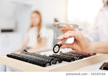 Scrupulous neat specialist taking a trial lens Scrupulous neat specialist taking a trial lens 30185584