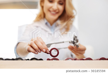 Diligent scrupulous lady arranging lenses Diligent scrupulous lady arranging lenses 30185594