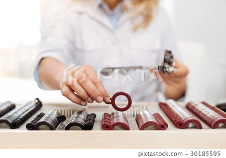 Neat wonderful optician organizing her set of 30185595