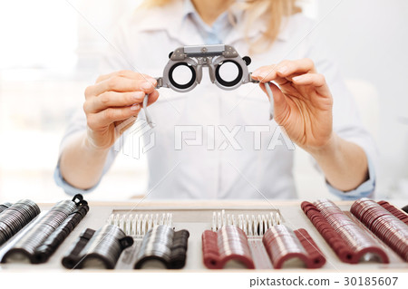 Lovely diligent optician suggesting trial 30185607