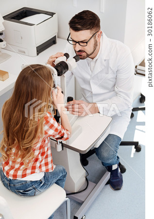 Trained experienced doctor adjusting the equipment 30186062