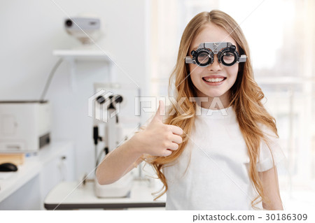 Cool positive girl trying different lenses 30186309