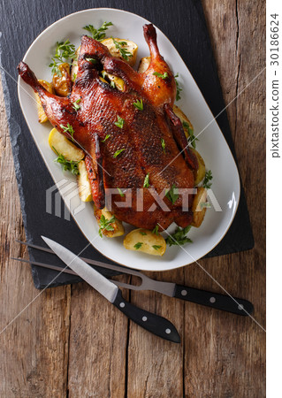 Home-baked duck stuffed with apples close-up Home-baked duck stuffed with apples close-up 30186624