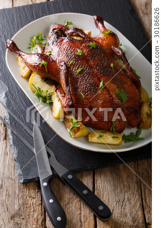 Delicious festive duck with apples and greens 30186626