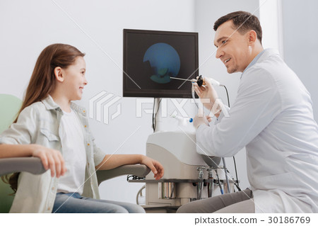 Smiling girl being ready for health examination Smiling girl being ready for health examination 30186769