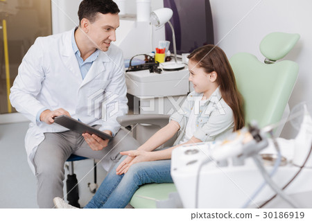 Little pretty patient smiling to her doctor Little pretty patient smiling to her doctor 30186919