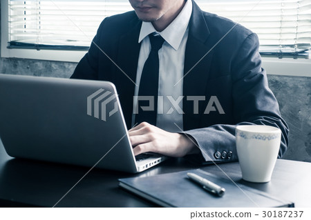 Close up of Businessman working on the office desk 30187237