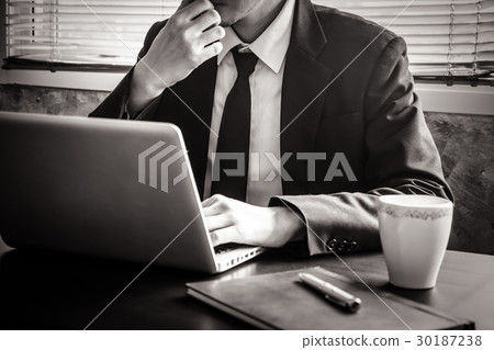 Close up of Businessman working on the office desk Close up of Businessman working on the office desk 30187238
