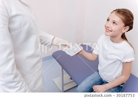 Attractive little patient sitting in consulting Attractive little patient sitting in consulting 30187753