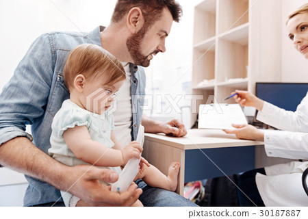 Surprised kid watching plastic box for medicine 30187887